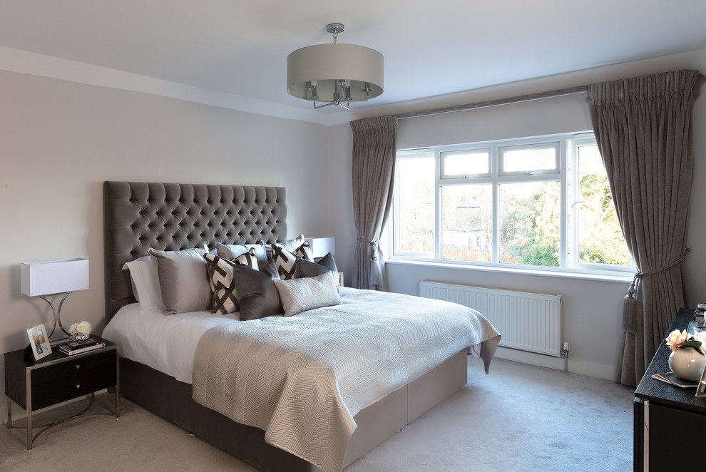 Bedroom - large contemporary master carpeted and gray floor bedroom idea in London with gray walls