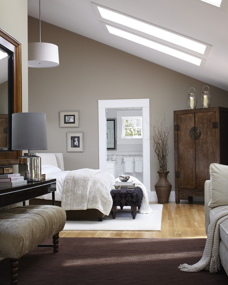 Photo of a traditional grey and brown bedroom in San Francisco with grey walls, light hardwood flooring and feature lighting.