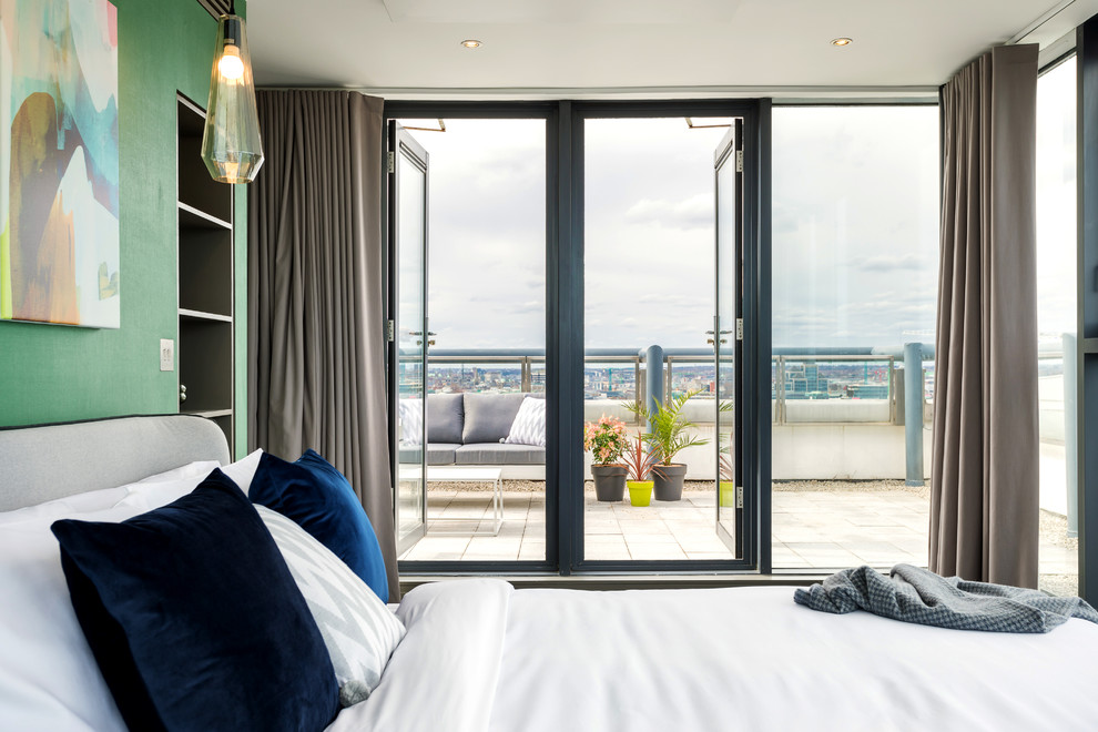 This is an example of a medium sized contemporary bedroom in Dublin.