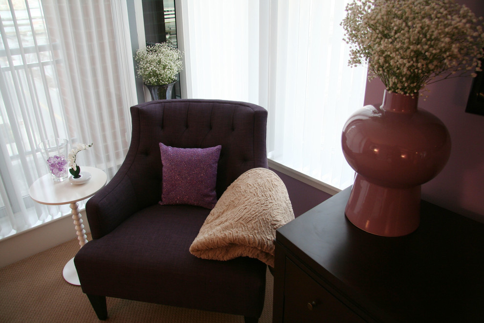 This is an example of a medium sized contemporary master bedroom in New York with purple walls and carpet.