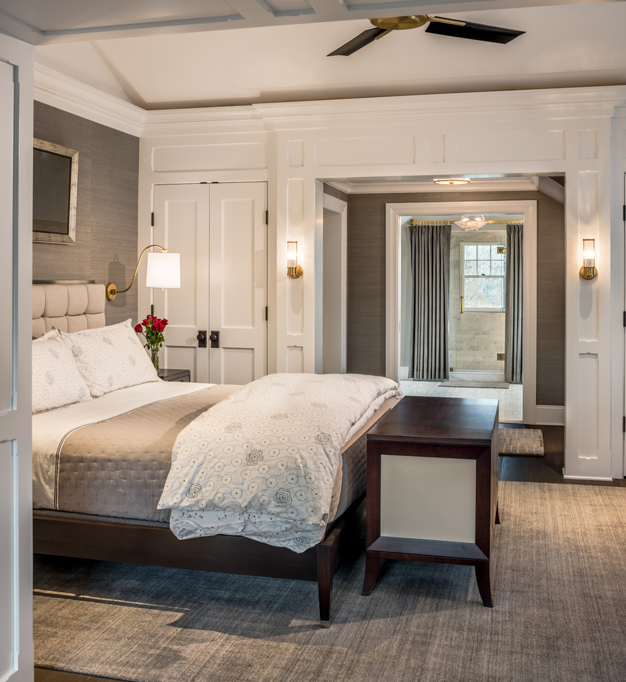Photo of a large coastal master bedroom in New York with grey walls, dark hardwood flooring and brown floors.