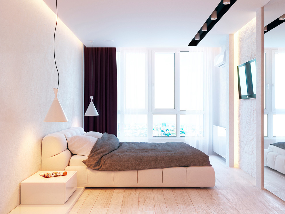 Diseño de dormitorio principal contemporáneo de tamaño medio sin chimenea con paredes blancas y suelo de madera clara