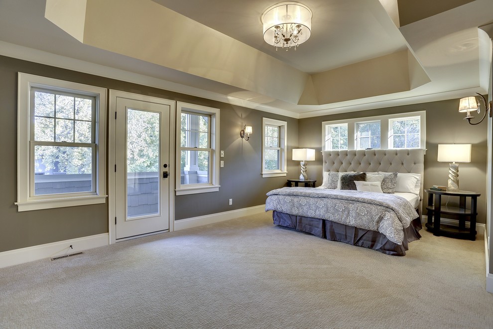 Photo of a traditional master bedroom in Minneapolis with grey walls, carpet and no fireplace.