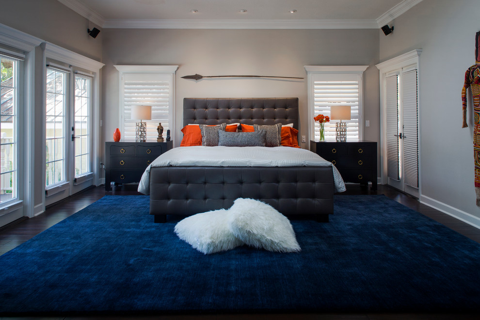 Design ideas for a large traditional master bedroom in Tampa with grey walls, dark hardwood flooring and no fireplace.