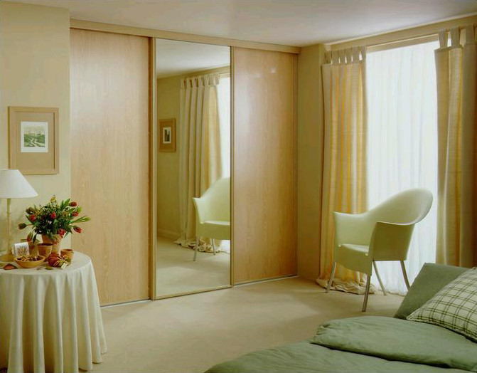 Example of a mid-sized classic master dark wood floor bedroom design in Toronto with beige walls