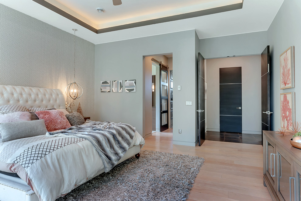 This is an example of a medium sized contemporary master and grey and brown bedroom in Minneapolis with grey walls, light hardwood flooring, no fireplace and beige floors.