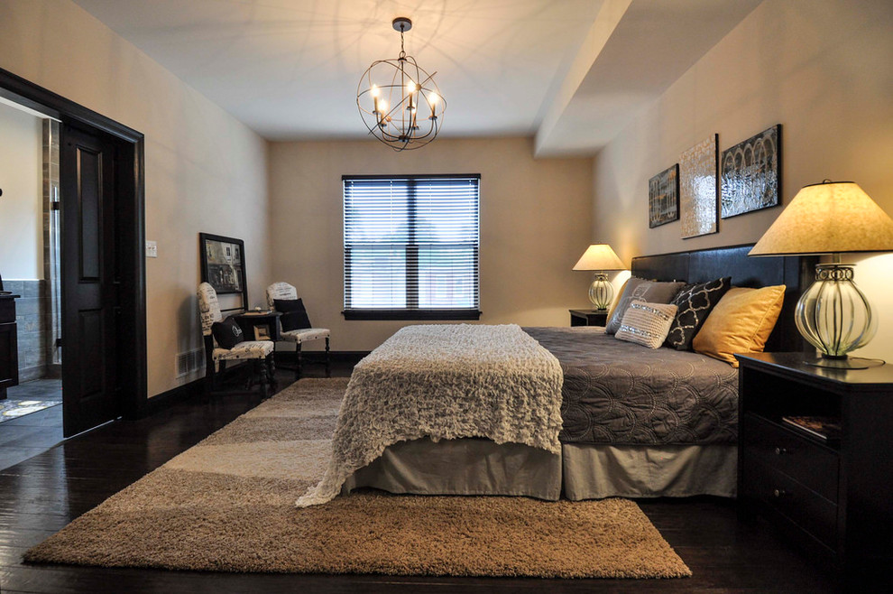 Inspiration for a large transitional master dark wood floor and brown floor bedroom remodel in St Louis with gray walls and no fireplace