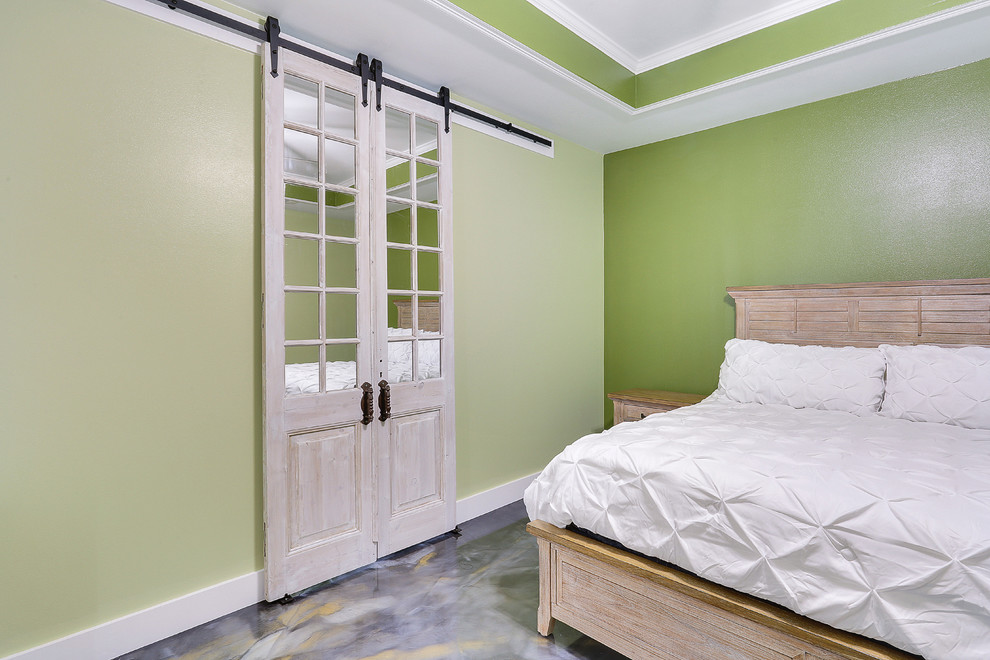 Bedroom - large transitional master concrete floor and multicolored floor bedroom idea in New Orleans with green walls and no fireplace