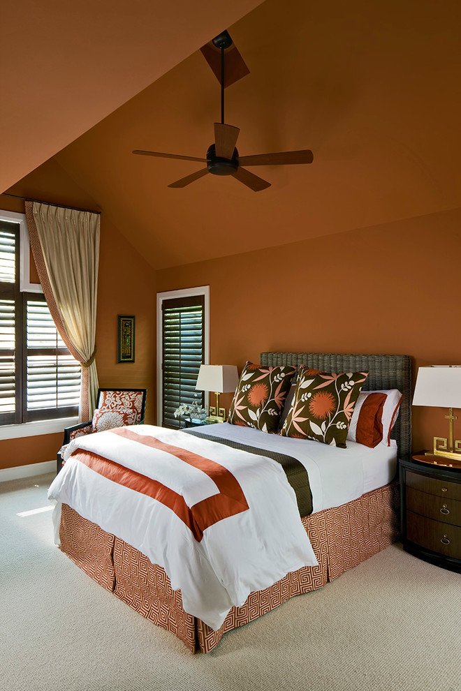 Inspiration for a timeless carpeted bedroom remodel in New York with orange walls