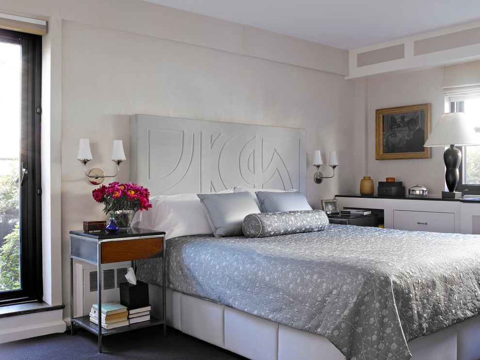 Inspiration for a contemporary bedroom remodel in New York with beige walls