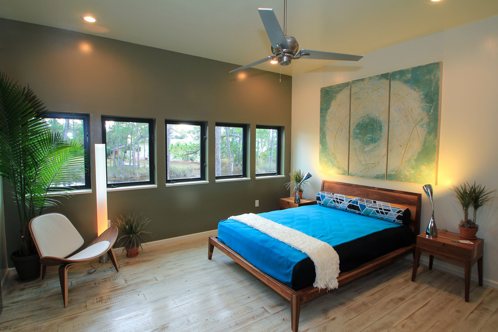 Photo of a contemporary master bedroom in Miami with green walls and no fireplace.