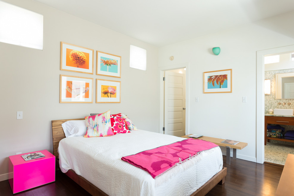Photo of a medium sized coastal guest bedroom in Los Angeles with white walls and dark hardwood flooring.