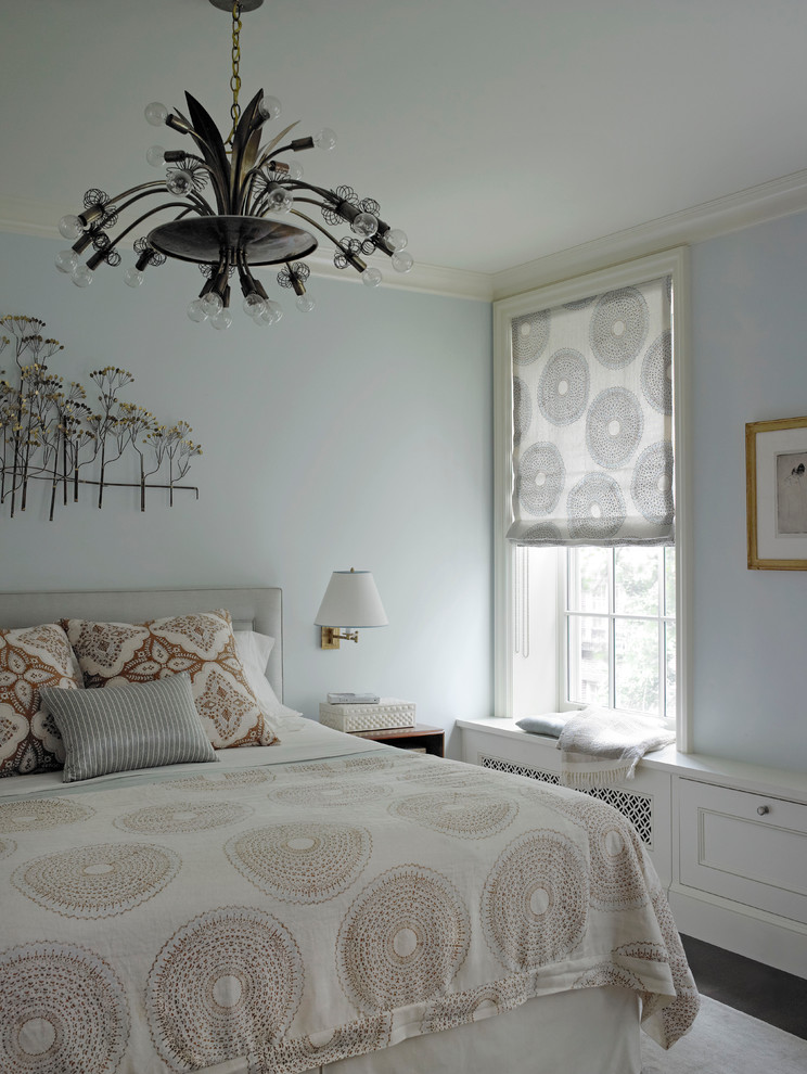 This is an example of a modern bedroom in New York with blue walls.