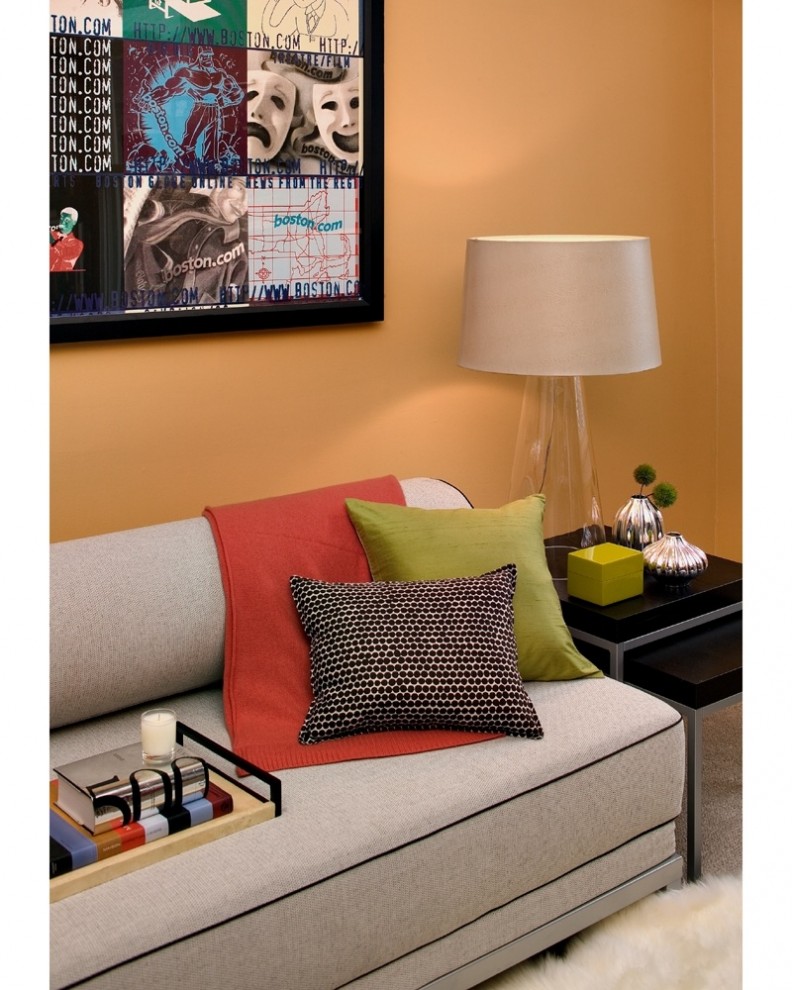 Inspiration for a modern bedroom remodel in Boston with orange walls