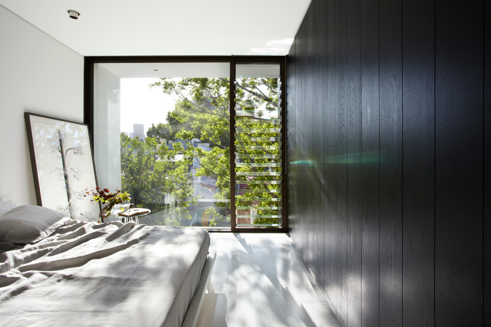 Photo of a contemporary bedroom in Sydney with black walls.