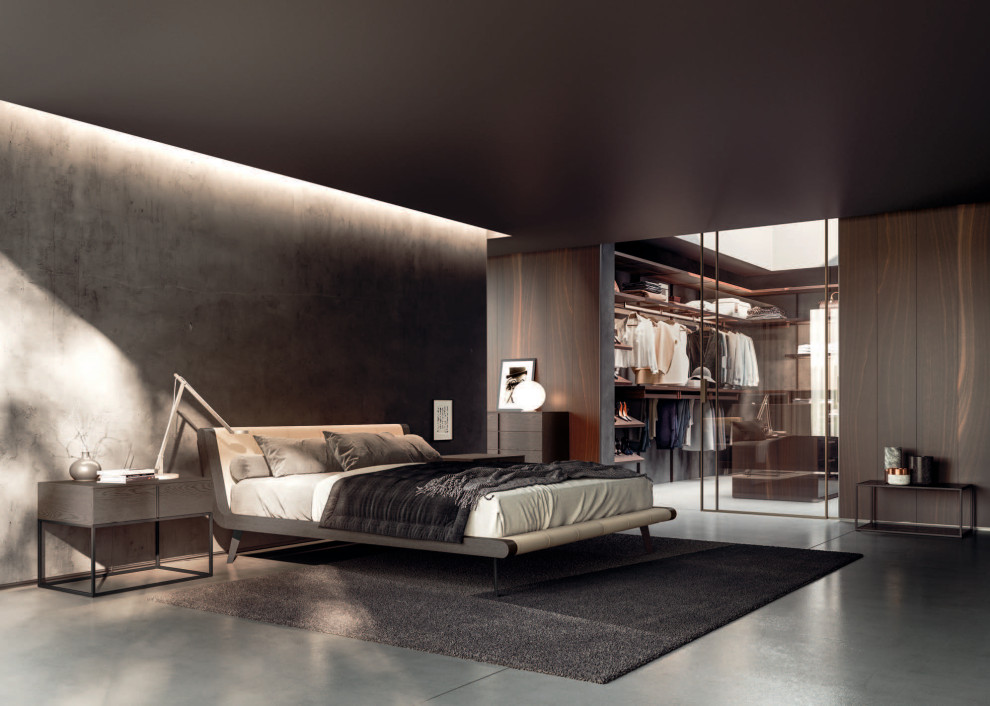 Immagine di una grande camera matrimoniale minimalista con pavimento in cemento, pavimento grigio e pareti in legno