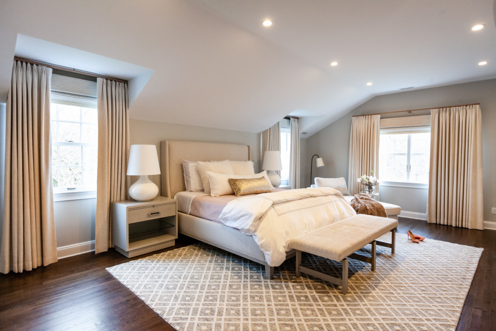 Example of a transitional dark wood floor and brown floor bedroom design in New York with gray walls