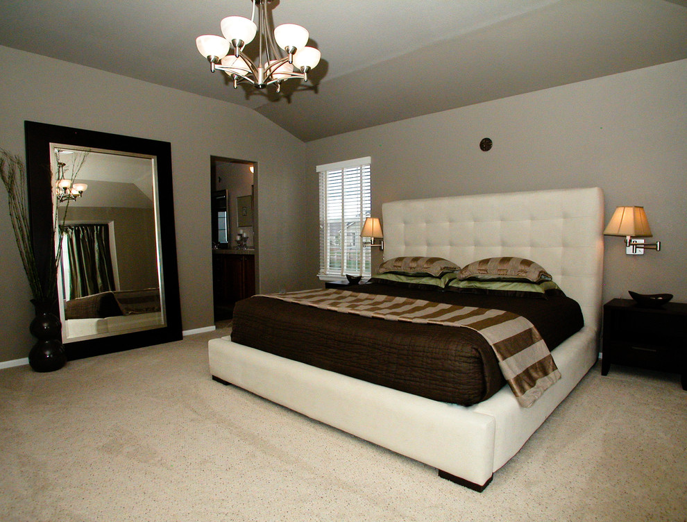 Example of a large trendy master carpeted bedroom design in Denver