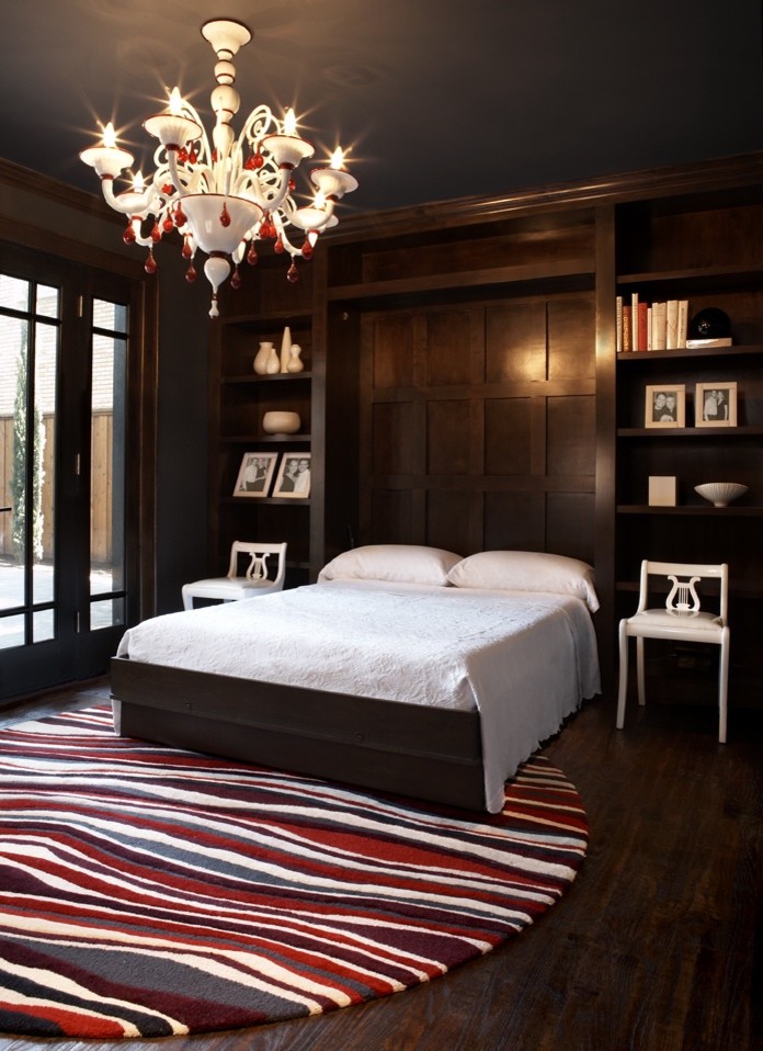 Trendy guest dark wood floor bedroom photo in Seattle with black walls