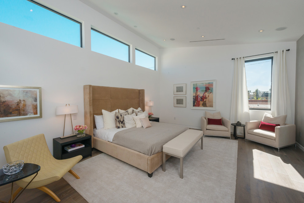 Photo of a medium sized contemporary master bedroom in Los Angeles with white walls and medium hardwood flooring.