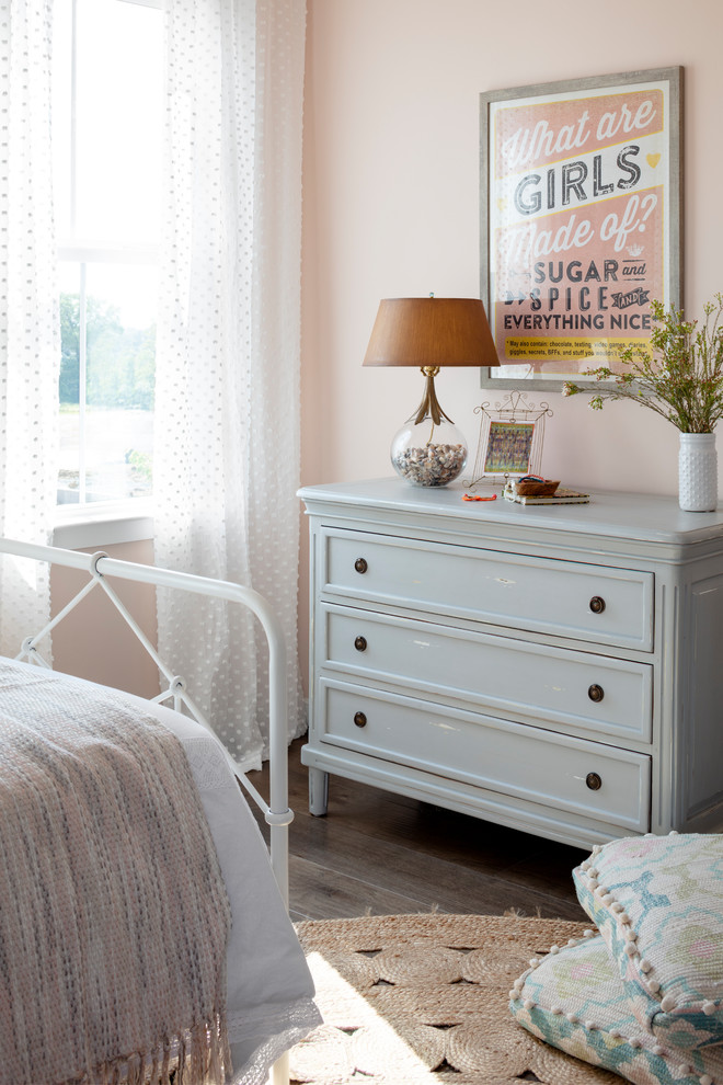 Bedroom - mid-sized country guest dark wood floor and brown floor bedroom idea in DC Metro with pink walls