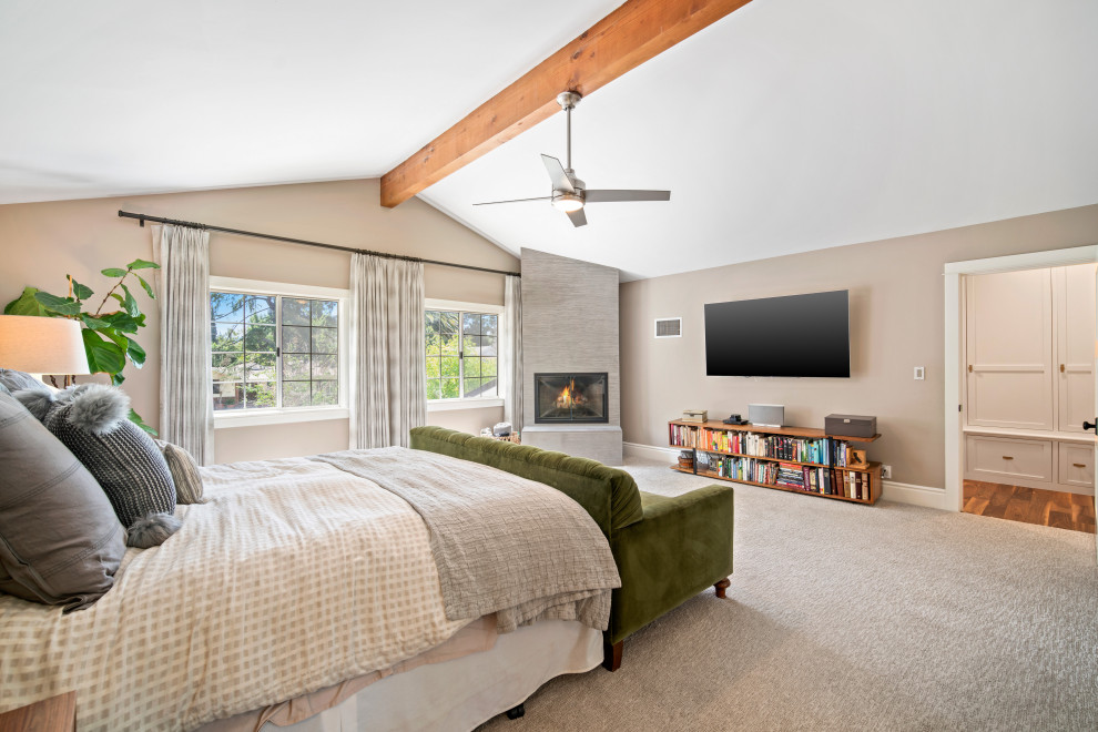 Example of a transitional carpeted and gray floor bedroom design in Los Angeles with beige walls and a corner fireplace