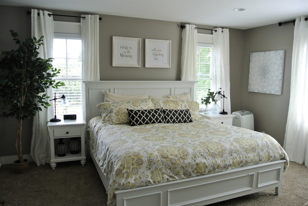 Example of a large cottage master carpeted bedroom design in Grand Rapids with gray walls