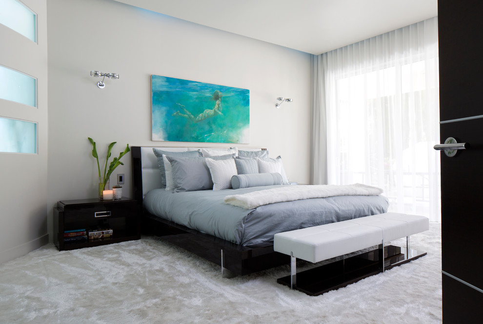 Example of a trendy master carpeted bedroom design in Orlando with gray walls