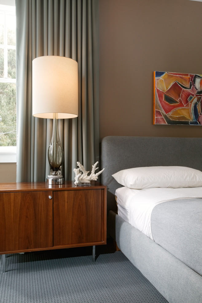 Mid-century modern bedroom photo in New Orleans with beige walls
