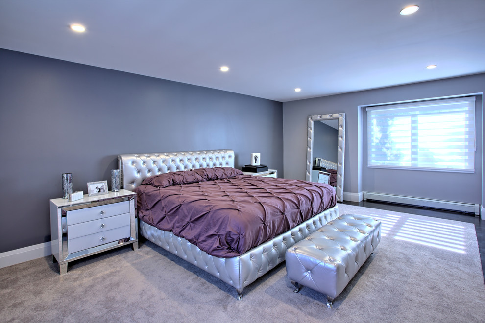 Example of a large minimalist master carpeted bedroom design in Miami with gray walls