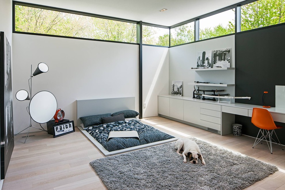Example of a danish bedroom design in Toronto with white walls