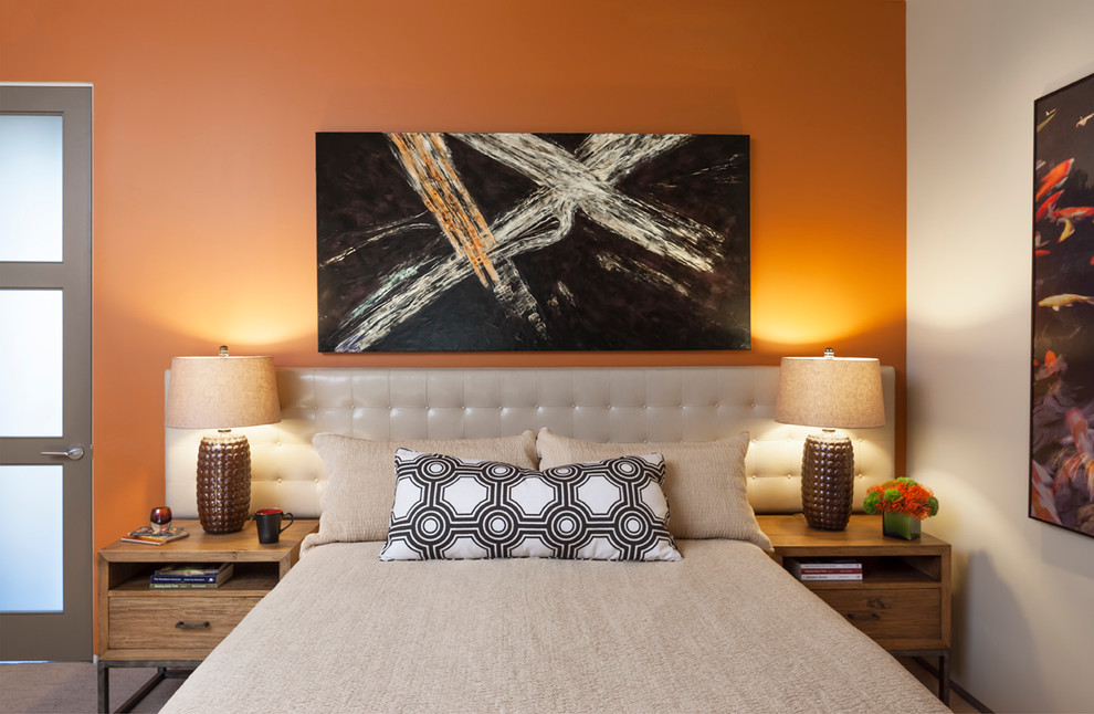 Example of a mid-sized trendy bedroom design in Los Angeles with orange walls