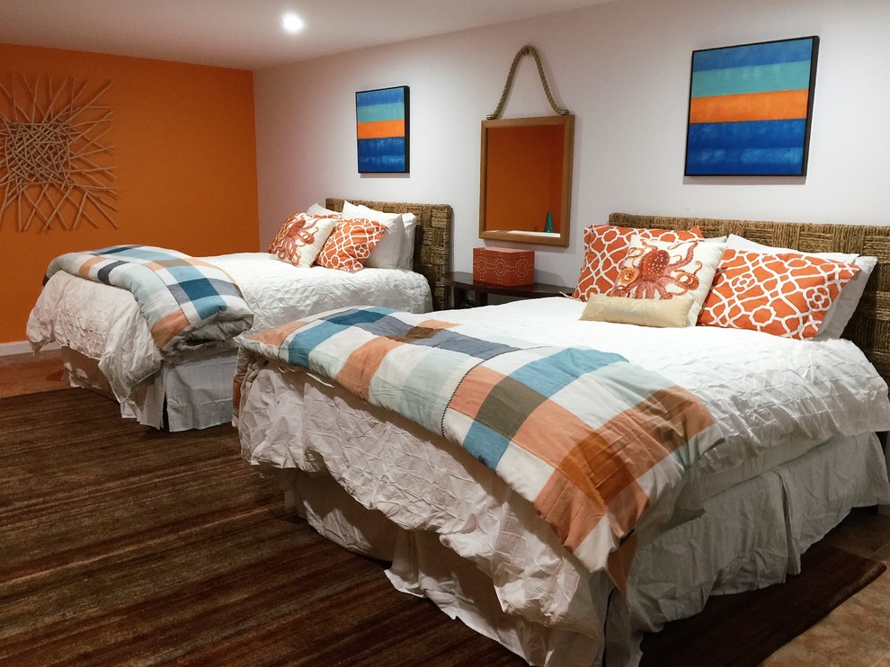 Photo of a large modern guest bedroom in San Diego with orange walls, travertine flooring and no fireplace.