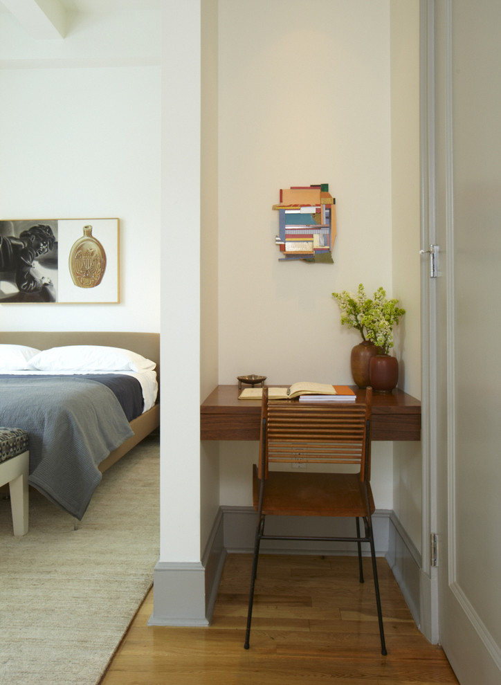 Bedroom - modern medium tone wood floor bedroom idea in San Francisco with beige walls