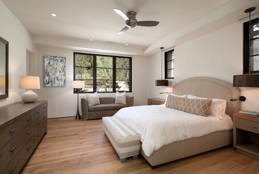 Inspiration for a large mediterranean guest carpeted bedroom remodel in Santa Barbara with white walls and no fireplace