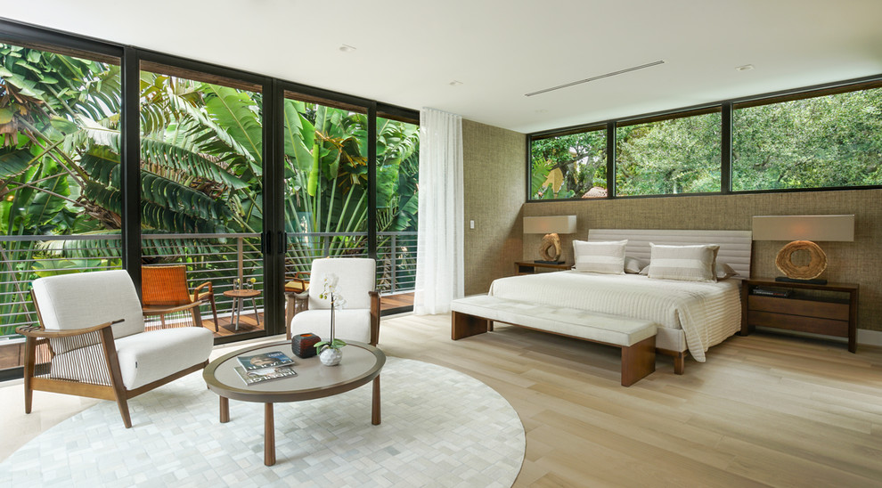 Photo of a medium sized contemporary master bedroom in Miami with brown walls, light hardwood flooring and beige floors.