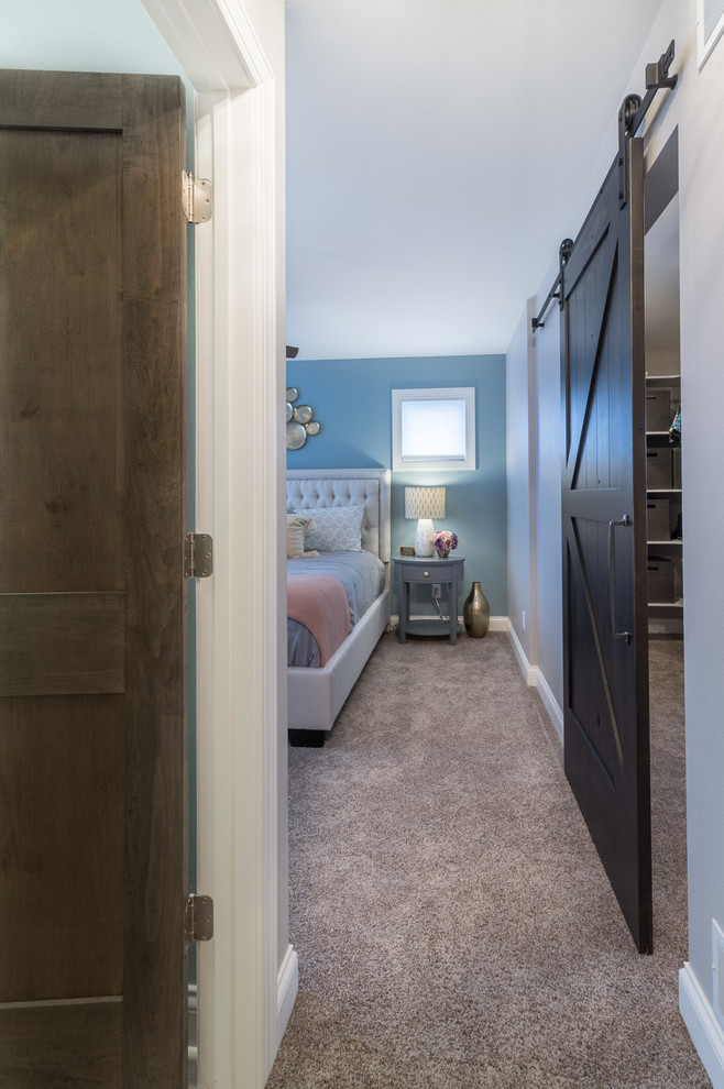 This is an example of a medium sized classic master bedroom in Other with blue walls, carpet and grey floors.