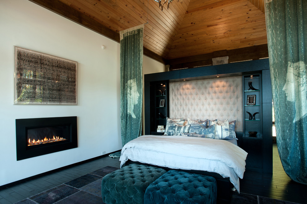 Inspiration for a contemporary master bedroom in Charlotte with white walls and a ribbon fireplace.