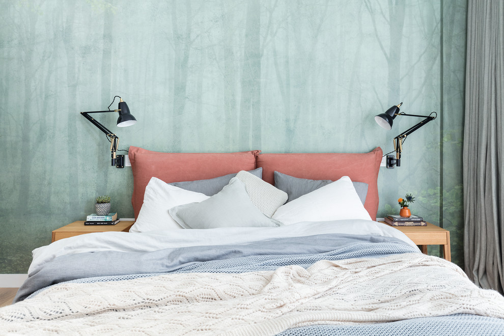 Example of a transitional bedroom design in London with green walls