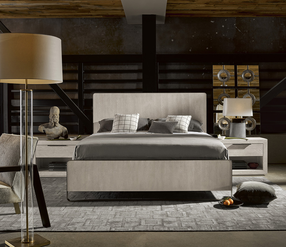 Foto de dormitorio tipo loft moderno con paredes grises, suelo de cemento y suelo gris