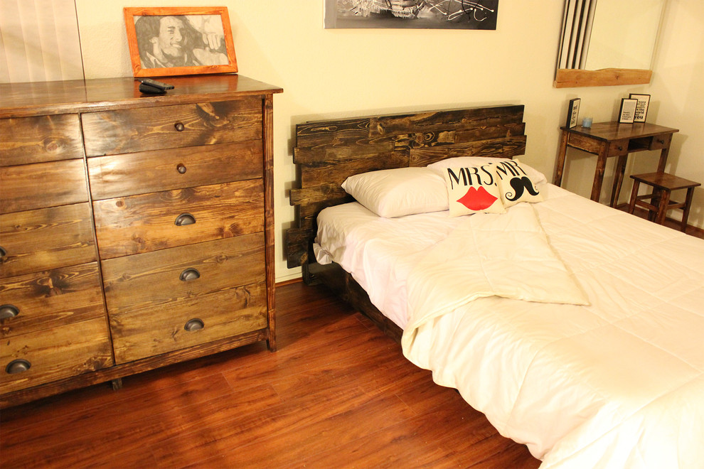 This is an example of a medium sized rustic master bedroom in Phoenix.