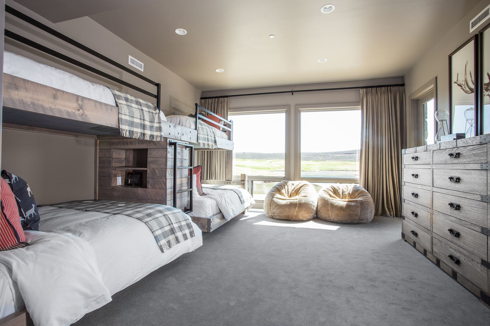 Example of a mountain style guest carpeted bedroom design in Salt Lake City with beige walls