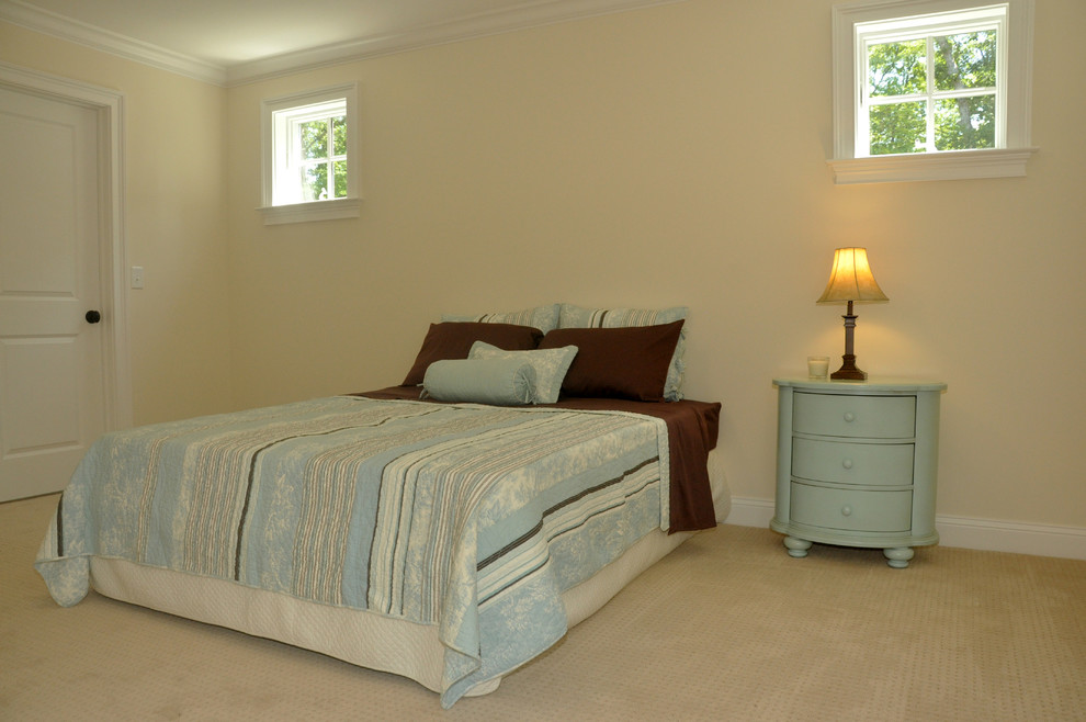 Example of a mid-sized beach style guest carpeted and beige floor bedroom design in New York with beige walls