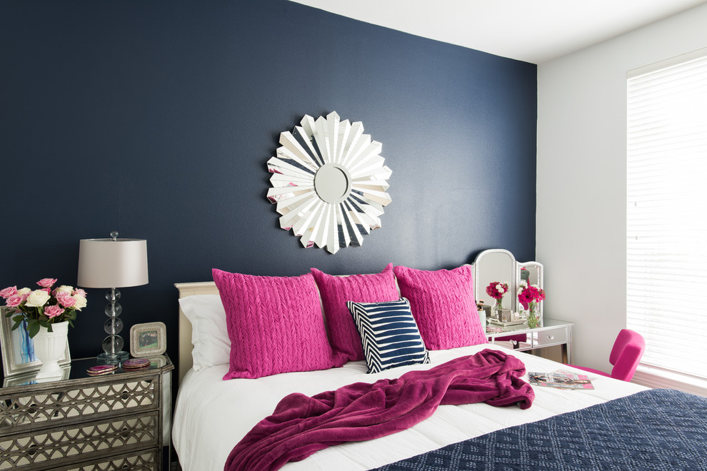 Photo of a large modern master bedroom in Dallas with blue walls and carpet.