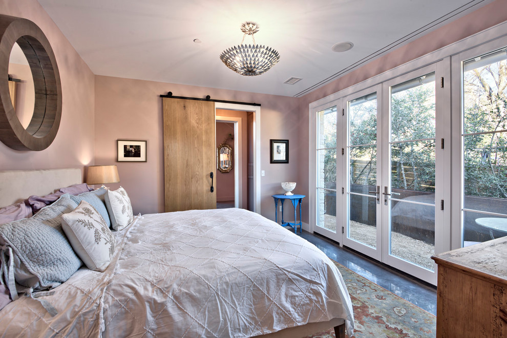 Small farmhouse master bedroom in Austin with purple walls and concrete flooring.