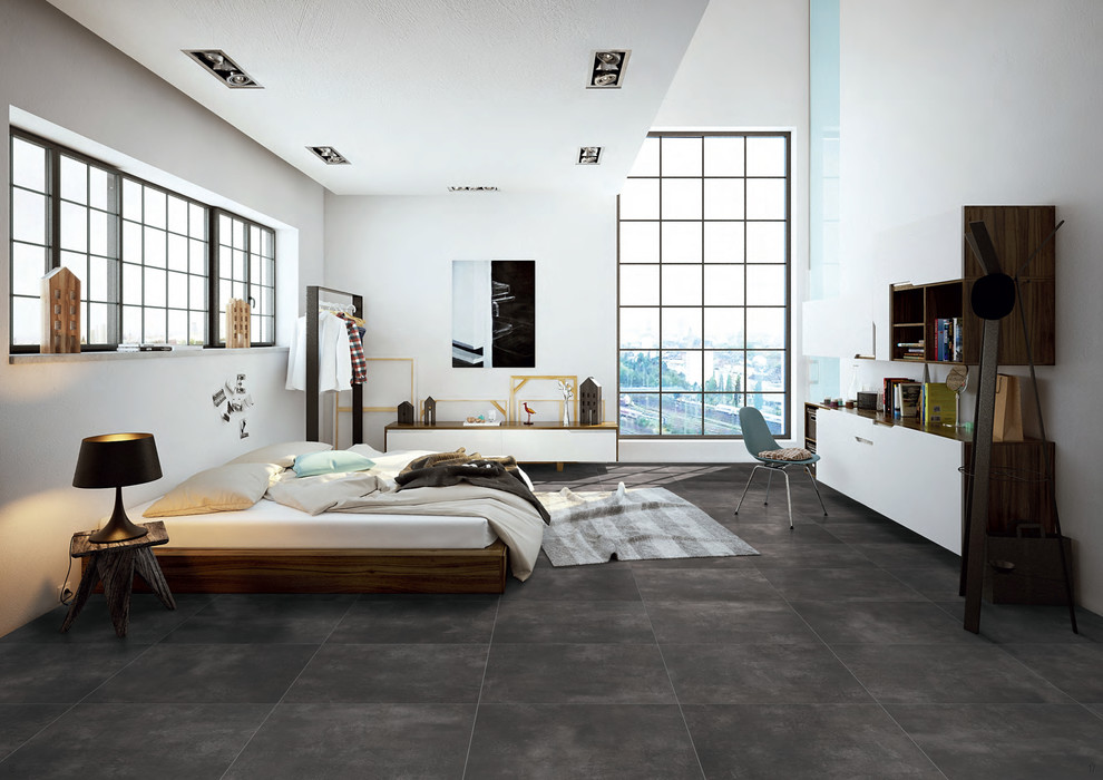 Idee per una grande camera da letto stile loft minimalista con pareti bianche, pavimento in gres porcellanato e pavimento grigio