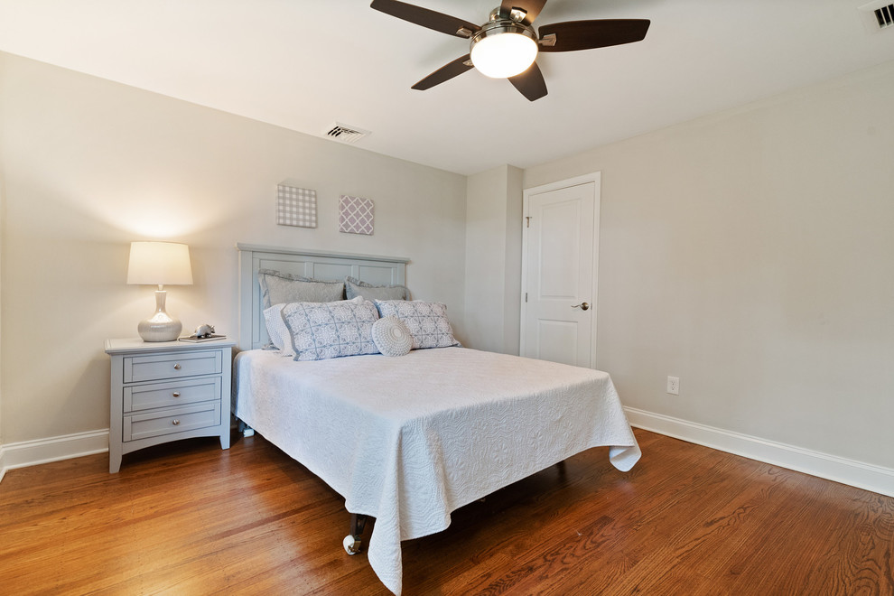 This is an example of a medium sized traditional bedroom in Philadelphia with medium hardwood flooring.