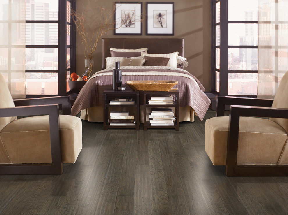 Example of a mid-sized classic master dark wood floor and brown floor bedroom design in Other with brown walls and no fireplace