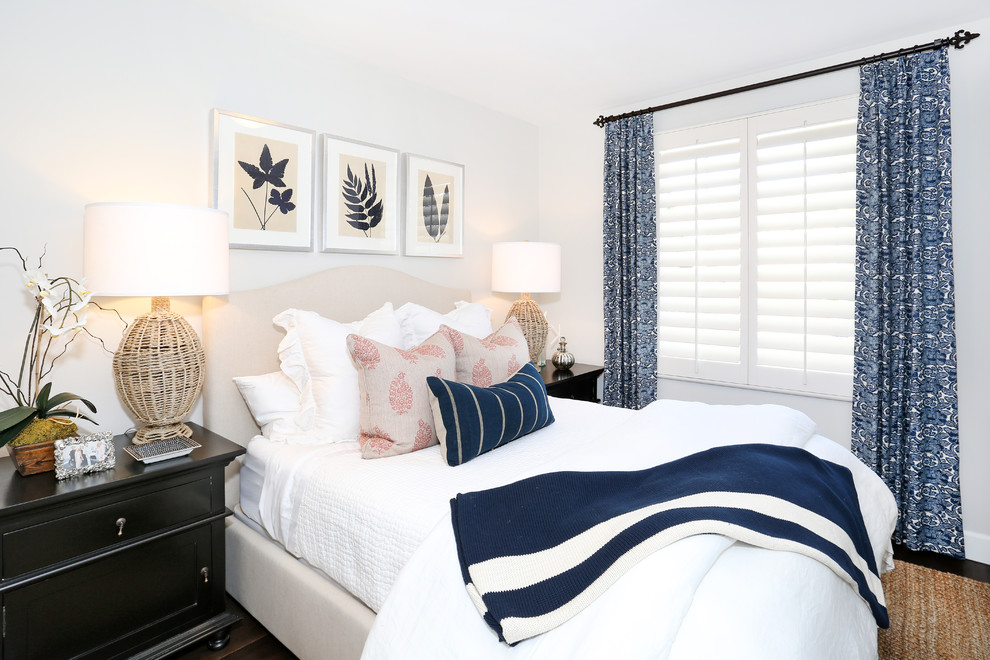 Inspiration for a coastal guest bedroom remodel in Orange County with white walls