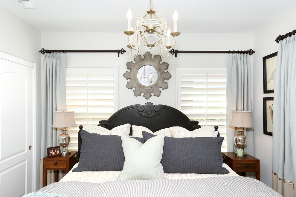 Beach style guest bedroom photo in Orange County with white walls